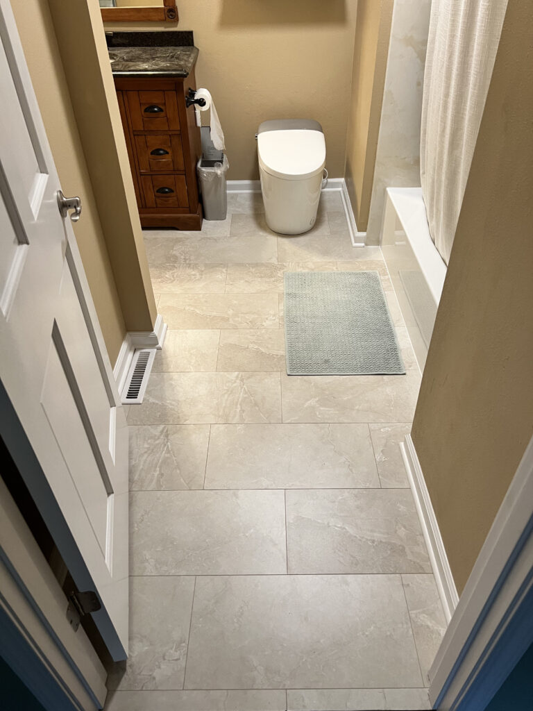 Wood-look flooring carried through a lower-level room