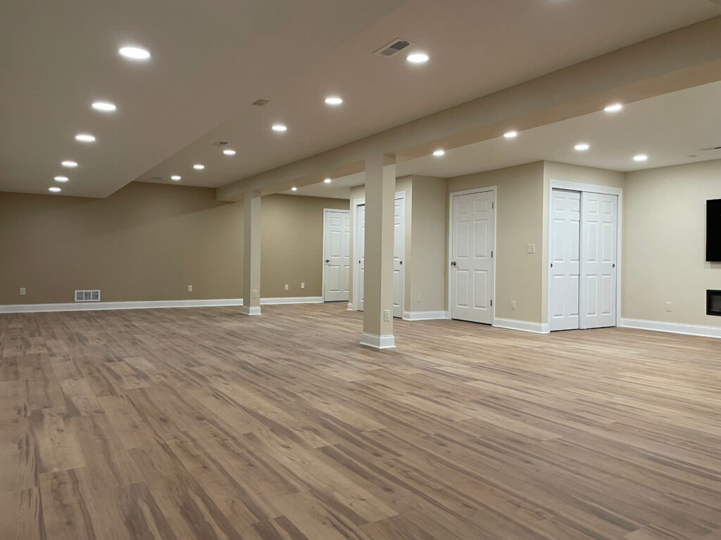 Completed light wood-look flooring across an open room