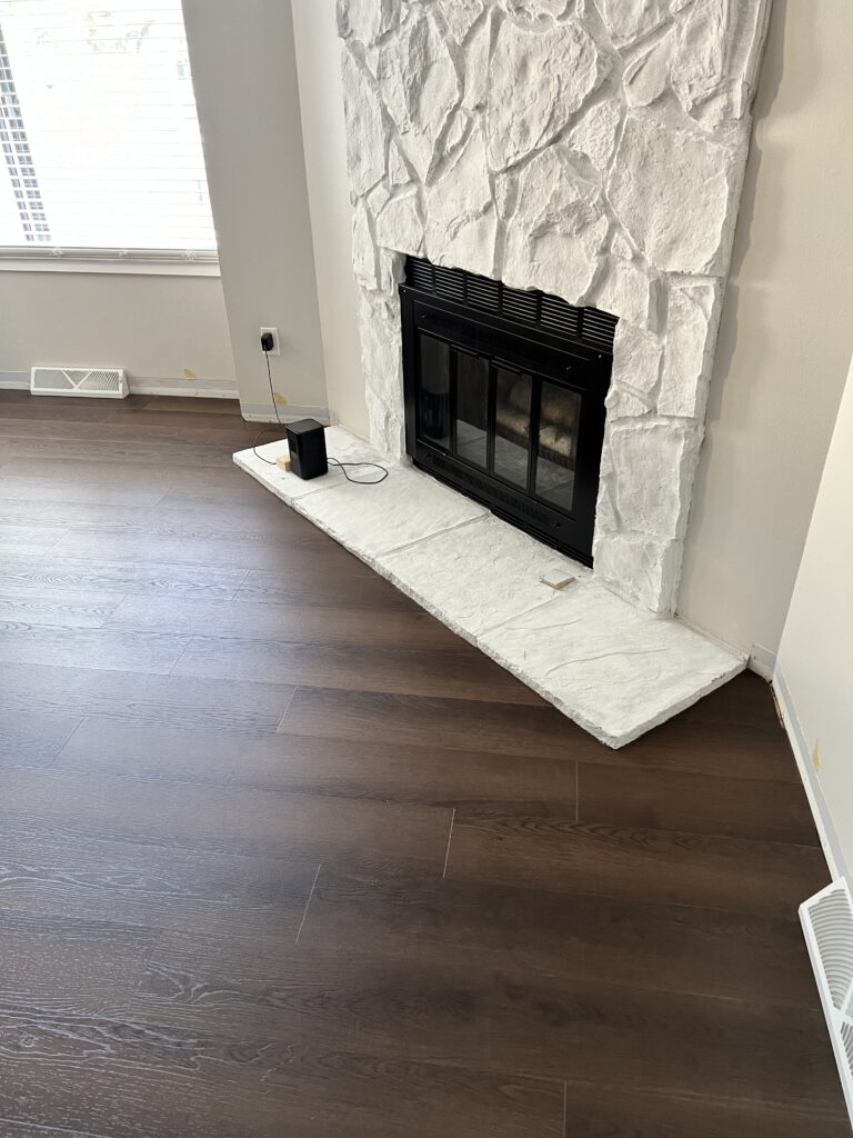 Finished light oak-look flooring and clean perimeter details