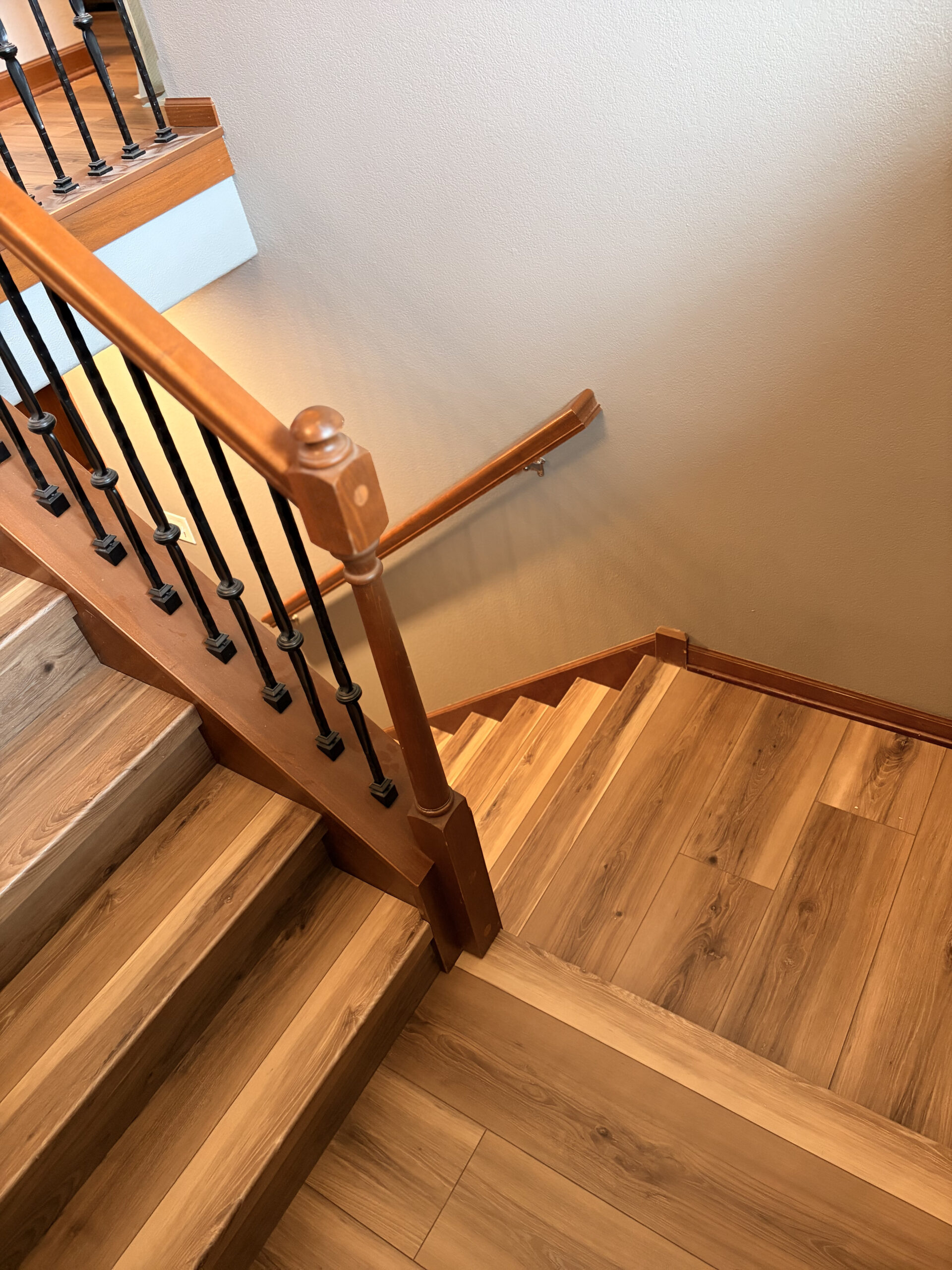 Finished LVP stairs, landing, and railing