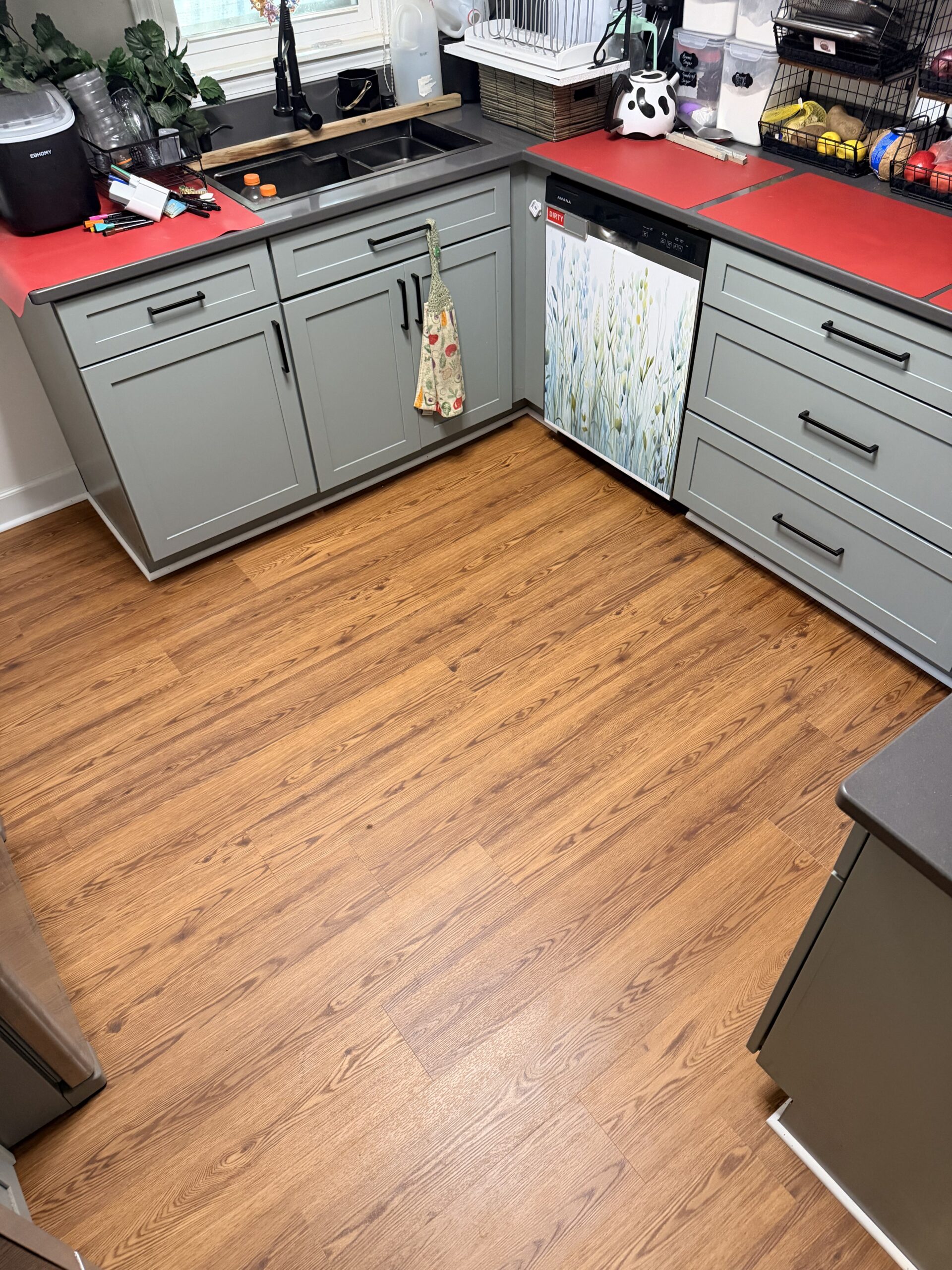 Warm oak-look LVP finished in a single updated kitchen