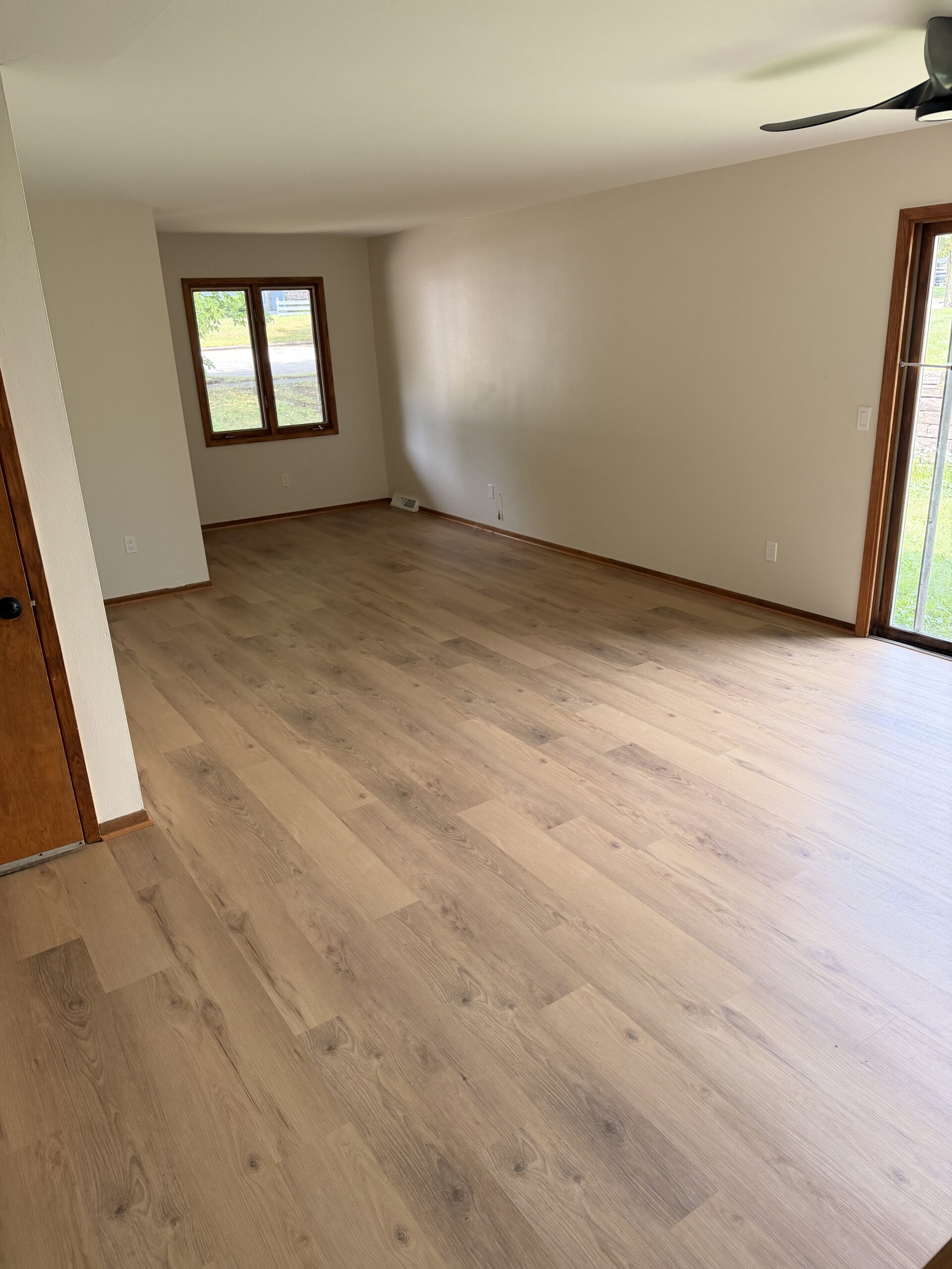 Finished natural maple LVP across the room