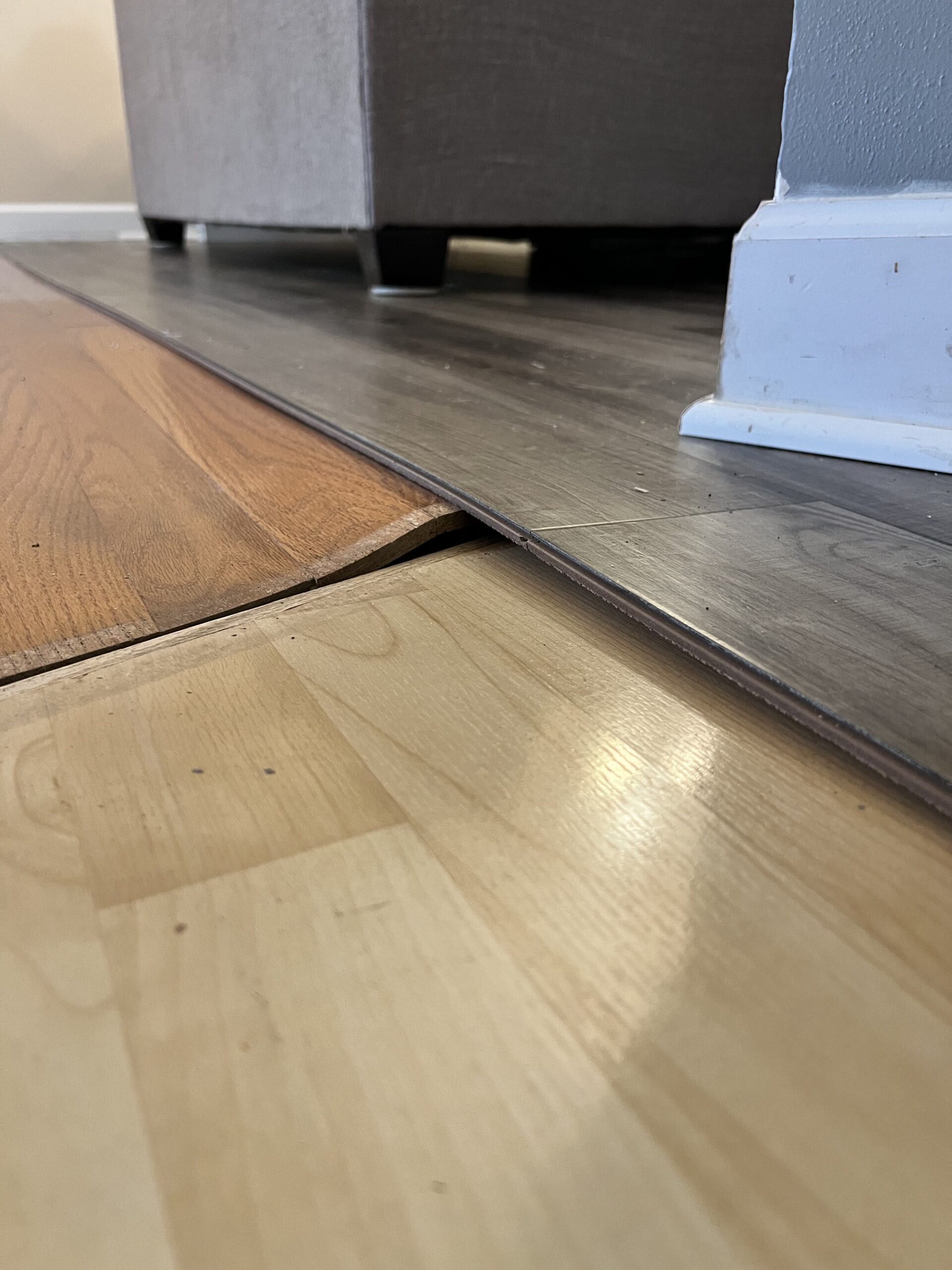 New plank meeting the existing floor at a room edge