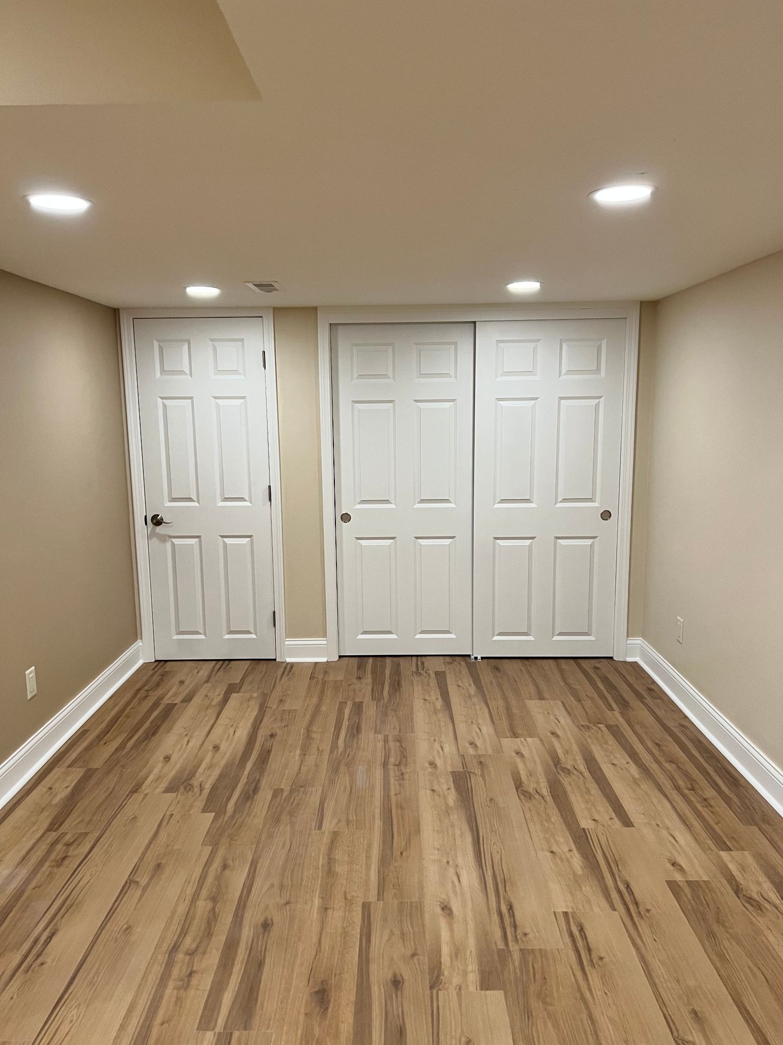 Lower-level doors and trim meeting new LVP