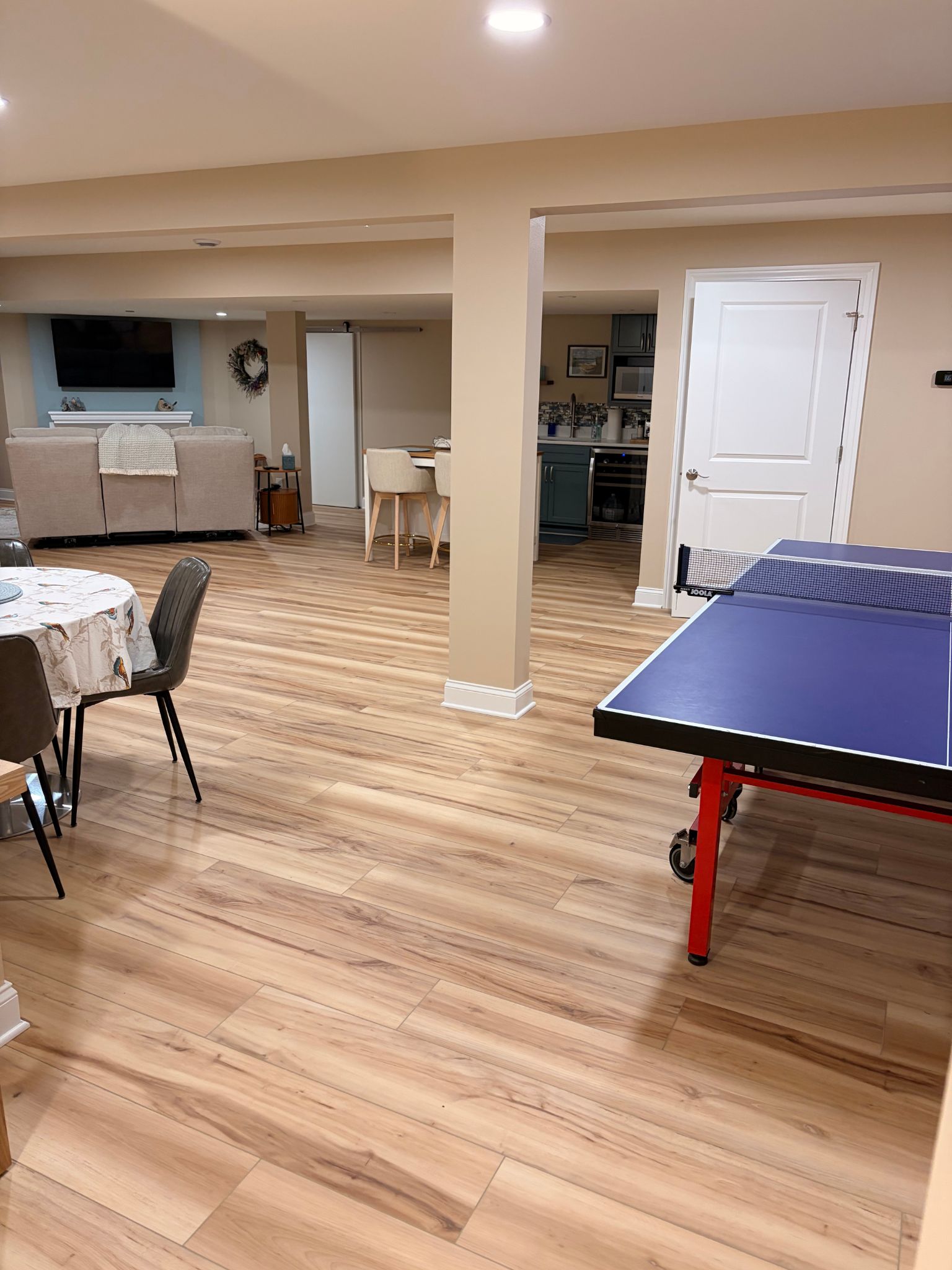 Finished basement rec room with LVP under the game table